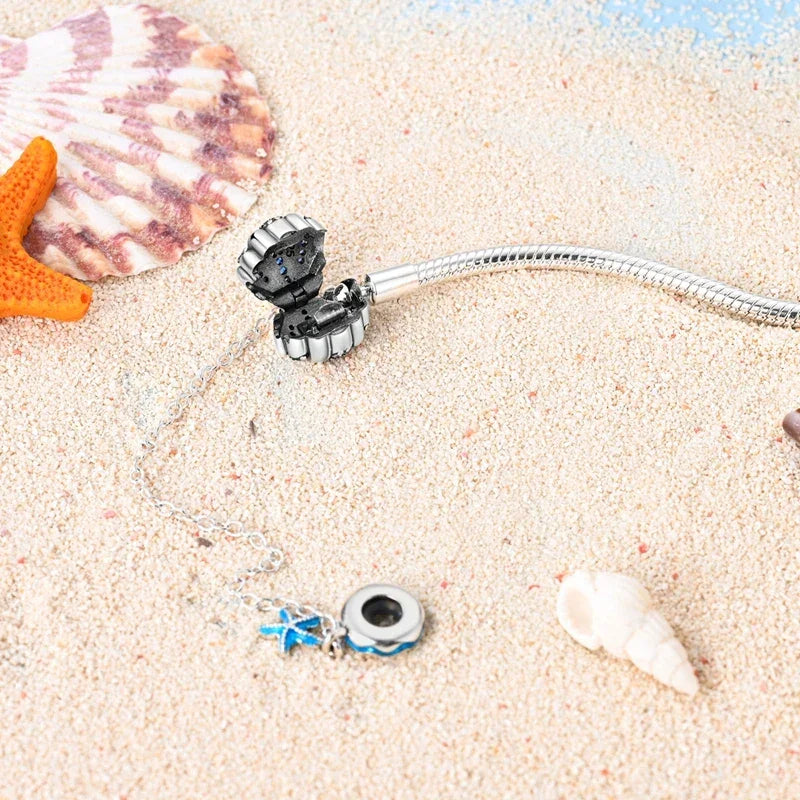 Sterling Silver Seashell Charm Bracelet with Blue CZ Gradient