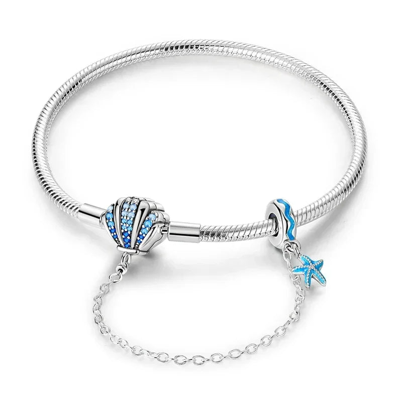 Sterling Silver Seashell Charm Bracelet with Blue CZ Gradient